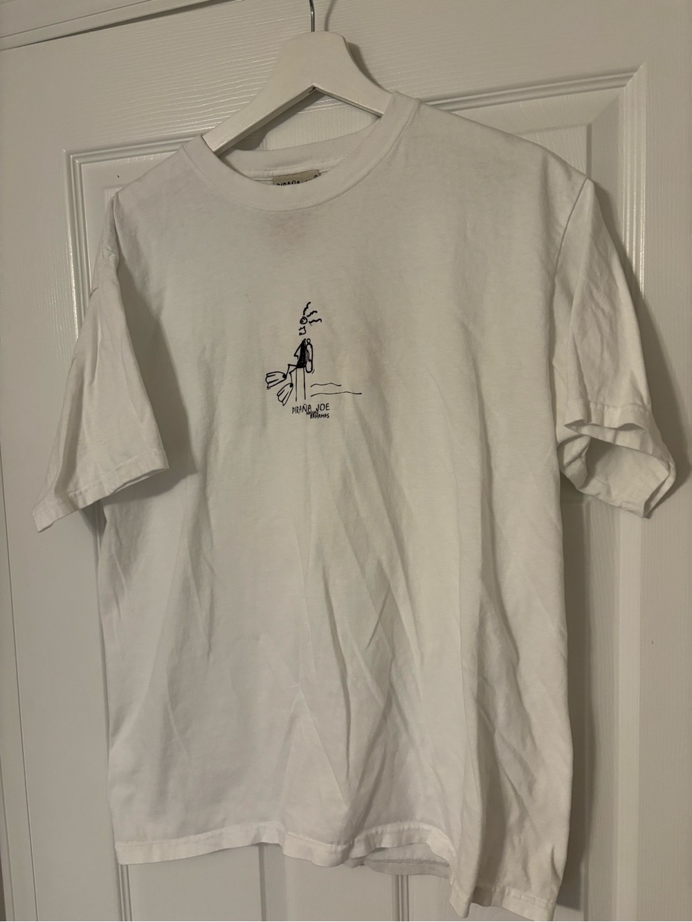 White Minimal Graphic Tee with Small Center Illustration